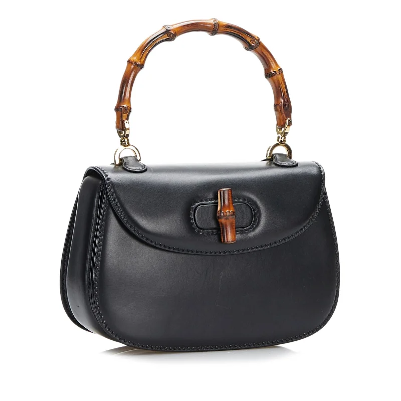 Women Gucci bags with a snap - button closure and a decorative charmGucci Bamboo Night (nOnuhq)