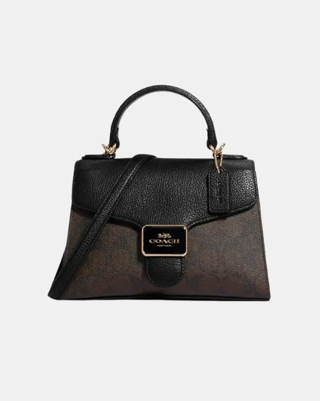 Coach Borough bags with a contrast - stitched handle for a unique lookCoach Pepper Satchel In Signature Canvas Brown Black