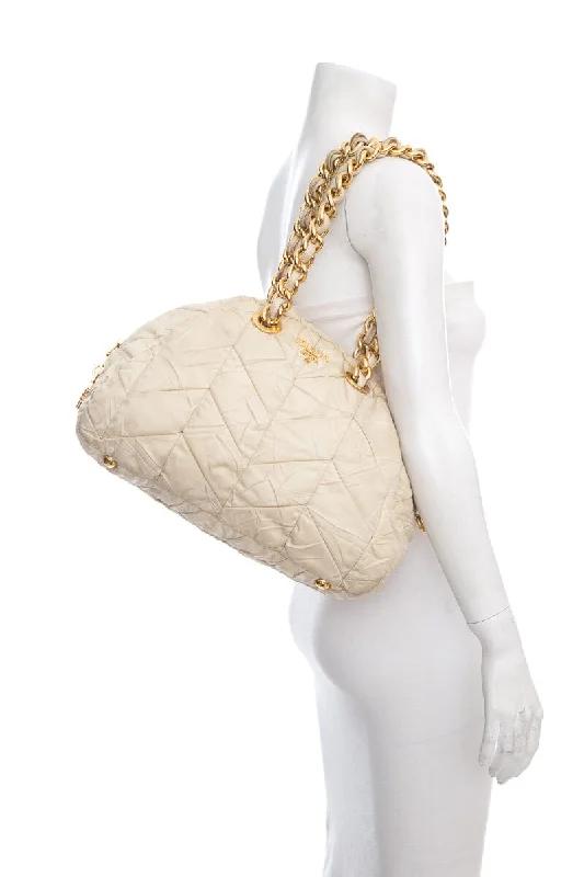 Ladies Prada Galleria bags with a detachable shoulder strapPrada Cream Quilted Puff Nylon Handbag