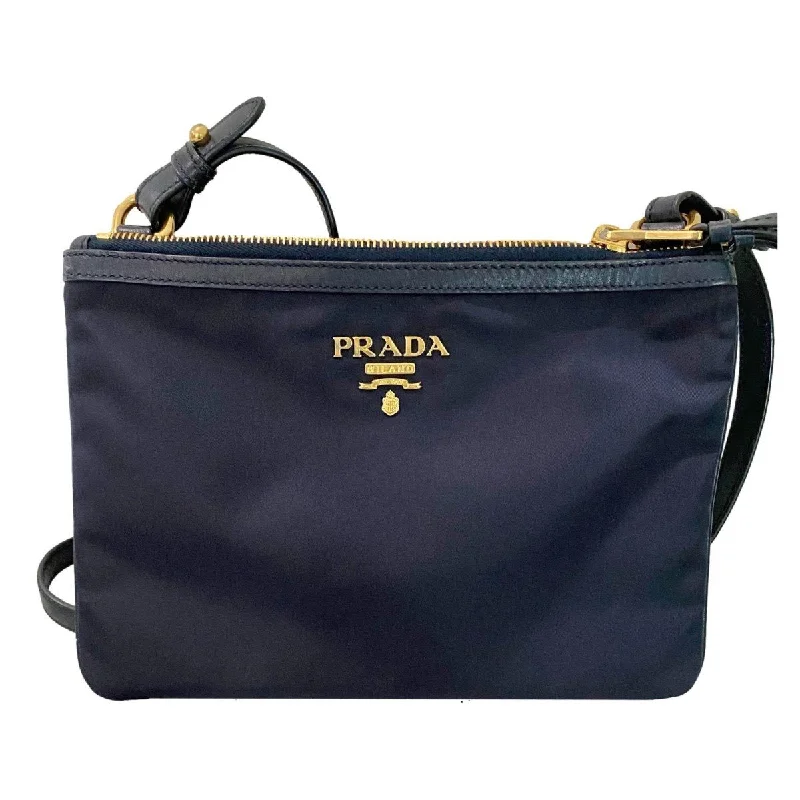 Prada Cleo bags with a detachable coin purse for added functionalityPrada Tessuto Nylon Blue Zip Calf Leather Cross Body Bag 1BH046