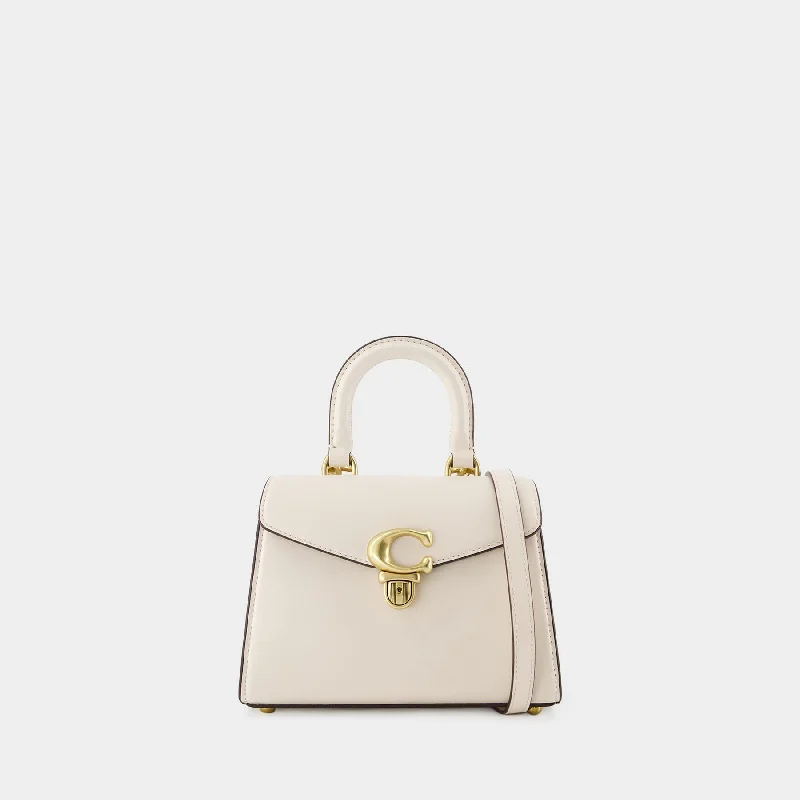 Coach Dempsey bags with a contrast - colored interior for visual interestSammy Top Handle 21 Bag - Coach - Leather - White