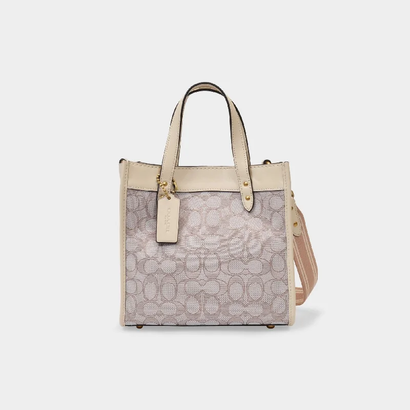 Coach bags with a zip - top closure and a front - pocket for quick accessTote 22 Bag in Beige Canvas