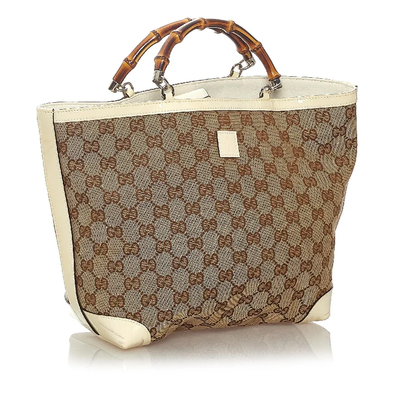 Women Gucci bags with a snap - button closure and a decorative charmGucci Bamboo GG Canvas Handbag (27277)