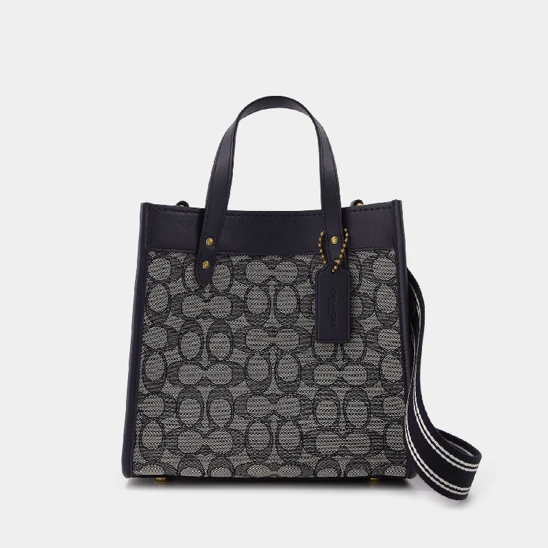 Coach handbags with a beaded trim for a glamorous and elegant lookField Tote 22 Tote Bag - Coach - Navy - Jacquard