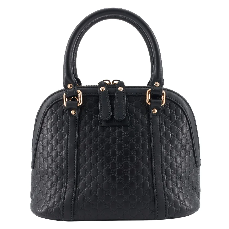 Ladies Gucci shoulder bags with a tassel decorationDome Mini Microguccissima Leather Bag