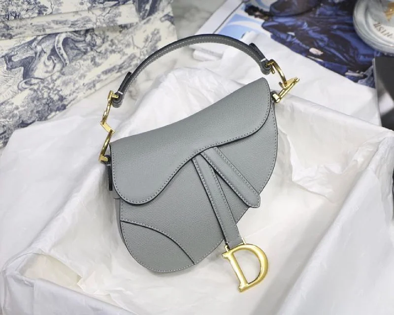 Christian Dior bags with a zip - top closure and multiple compartmentsChristian Dior Saddle Bag Light Blue Grained Gold Toned Hardware Canvas