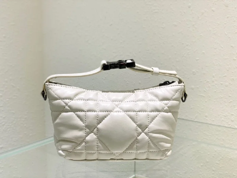 Christian Dior Saddle bags with a patent leather finish for a shiny lookChristian Dior Small DYORTravel Nomad Pouch White